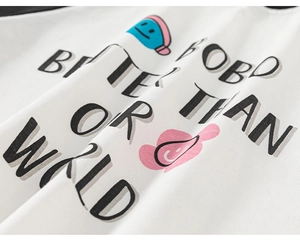Close-up of kids white cotton T-shirt featuring BOBO BETTER THAN WORLD letter print