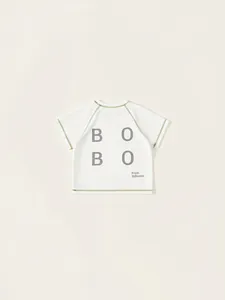 Kids white cotton T-shirt with green trim and BOBO letter print on the back