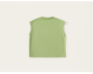 Detailed view of grass green sleeveless cotton top featuring fine knit texture and hem