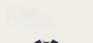 Close-up of navy blue kids jersey t-shirt showing contrast white neckline detail