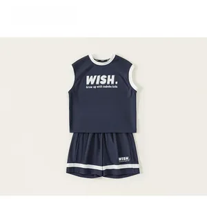 Detailed view of kids sleeveless sports set with navy blue fabric and white contrast binding