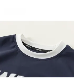 Close-up of navy blue mesh breathable fabric and white ribbed neckline with inner logo branding