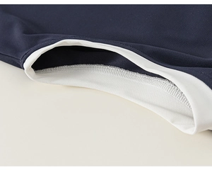 Detail of navy blue breathable mesh fabric and white elastic ribbed neckline stitching