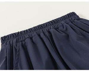 Detail view of the breathable mesh fabric and elastic waistband on boy's sportswear shorts
