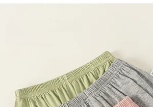 Detail showing elastic waistbands and soft knit texture of kids mosquito pants in three colors