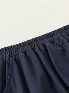Boys navy blue jersey shorts with breathable honeycomb texture and elastic waist detail