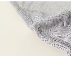 Macro detail of gray breathable mesh stitching and premium knit fabric on summer pants