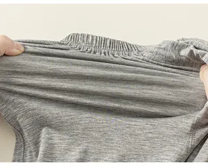 Detail of high-stretch elastic waistband on light gray kids anti-mosquito pants