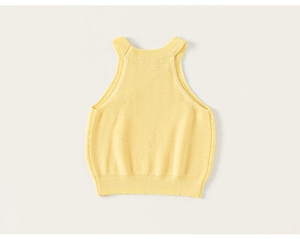 Close-up of yellow knit sleeveless vest featuring halter neck design and ribbed edges