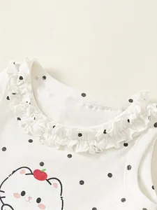 White sleeveless kids tank top with black polka dots, ruffle neck and cute cartoon cat