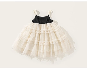 Detail of multi-layered mesh skirt with gold glitter dots on a girl's princess dress