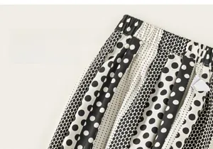 Close-up of kids' polka dot pants featuring elastic waist and breathable cotton texture