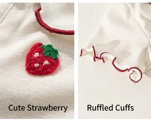 Close-up of strawberry embroidery and ruffled red edges on a toddler knit t-shirt