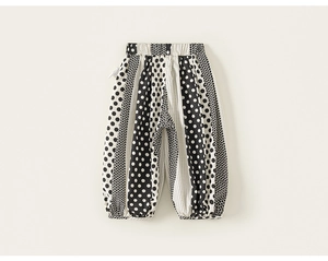 Detail view of polka dot stripe pattern on kids breathable cotton lantern pants