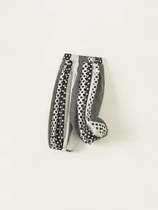 Kids lightweight polka dot print harem pants with black and white wavy stripe patterns
