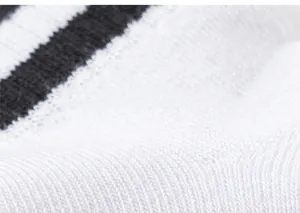 Close-up of breathable cotton knit fabric with black and white striped pattern