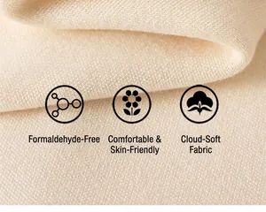 Close-up of soft beige knit fabric detail showing breathable texture and skin-friendly quality