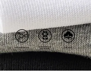 Close-up of skin-friendly striped cotton socks in white, gray, and black colors
