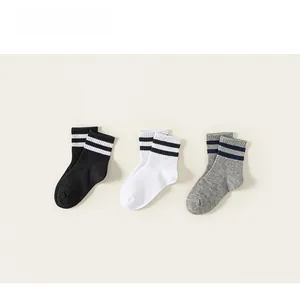 Three pairs of striped cotton crew socks for kids in black, white and grey colors