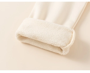 Detail of children's beige top with soft sherpa lining and knitted outer fabric
