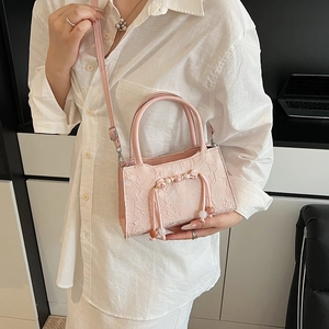 Elegant pink floral lace bucket bag with pearl accents and long tassel for women