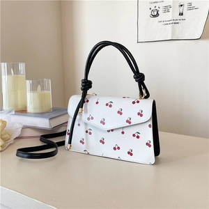Minimalist white crossbody bag with cherry print and knot handle for women