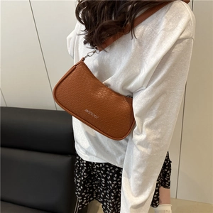 Brown woven texture underarm shoulder bag for women in a retro minimalist style