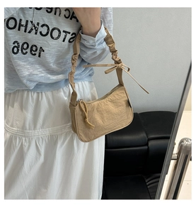 Casual khaki canvas shoulder bag with ruched strap and drawstring detail for women daily commute.
