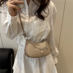 Chic glitter underarm bag for women, stylish crossbody bag with pearl chain and shiny finish.
