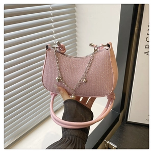Pink glitter baguette shoulder bag with stylish chain strap and trendy daily design for women.