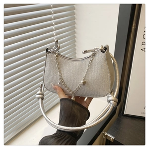 Silver glitter underarm shoulder bag detail view showing delicate chain and texture
