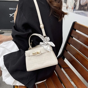 Elegant white crocodile texture handbag with silk scarf detail and golden lock