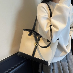 Large capacity tote bag with contrast piping and golden hardware for daily commute
