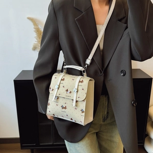 Mini crossbody backpack for women featuring cute cartoon dog and cherry patterns