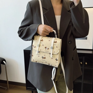 Elegant beige mini backpack with vintage dachshund print and white strap for women