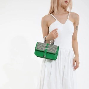 Minimalist green leather crossbody bag with gray herringbone flap and silver metal handle