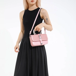 Pink minimalist leather handbag for women featuring V-shaped texture and silver U-shaped handle