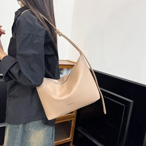 Minimalist beige matte leather tote bag for women with adjustable thin shoulder strap