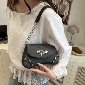 Minimalist black faux leather underarm bag with silver logo and metal chain strap
