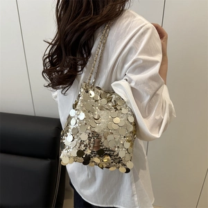 Sparkly champagne sequin bucket bag for women with silver chain shoulder strap design