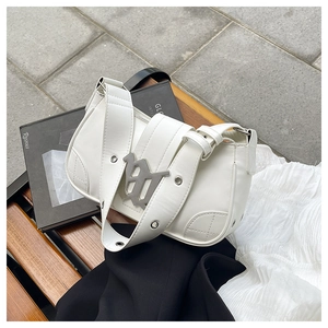 Detailed macro view of white PU leather baguette bag with silver metal eyelets and logo