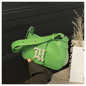 Detail of green leather baguette bag with gothic silver logo and eyelet strap