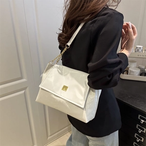 Minimalist white leather underarm bag with gold buckle and chain strap for women