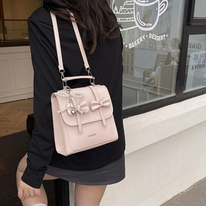 Pink PU leather backpack with bow decoration and pearl heart charm for women
