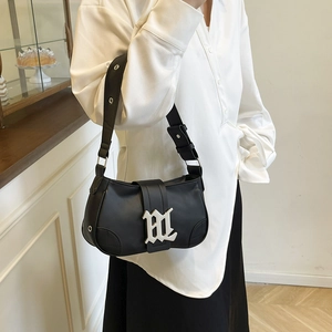 Minimalist black PU leather baguette bag with silver Gothic M buckle for a y2k aesthetic