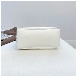 Detail view of the flat white faux leather base with reinforced double-stitch craftsmanship