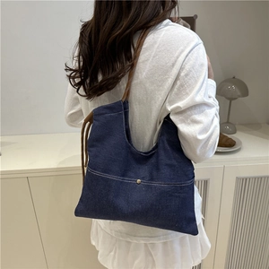 Vintage navy denim tote bag with contrast stitching and woven rope shoulder strap