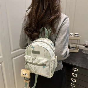 Mini Chinese style backpack in light green with bamboo print and plush eyes charm