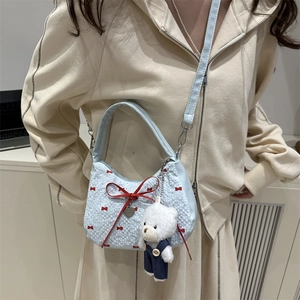 Blue crescent shoulder bag with red bow embroidery and cute plush bear charm accessory