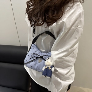 Blue striped crossbody bag with black heart dots and a cute plush bear pendant